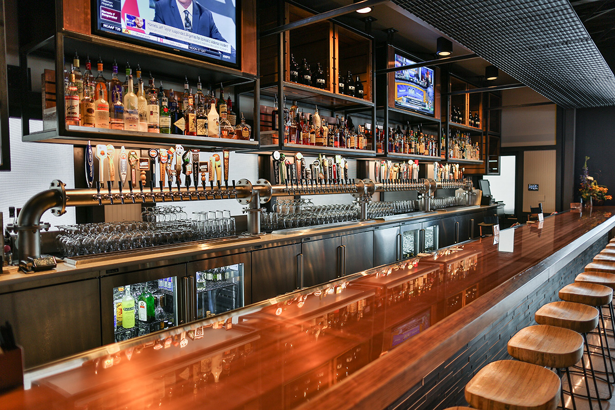 copper top bar with wood panel front, cherry arm rest