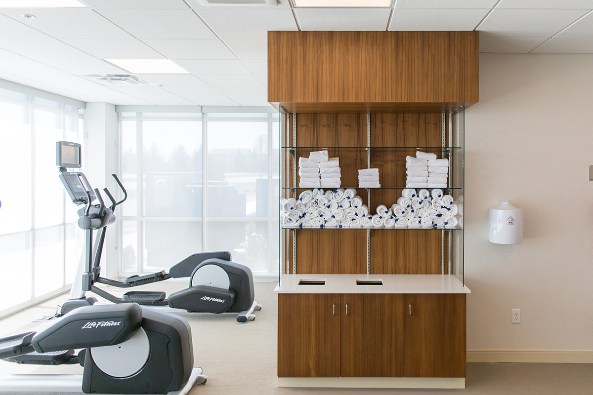 ustom fitness room storage cabinet in teak wood