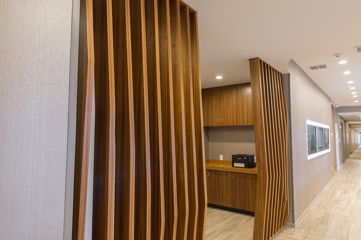office spaces with teak wood and weave walls