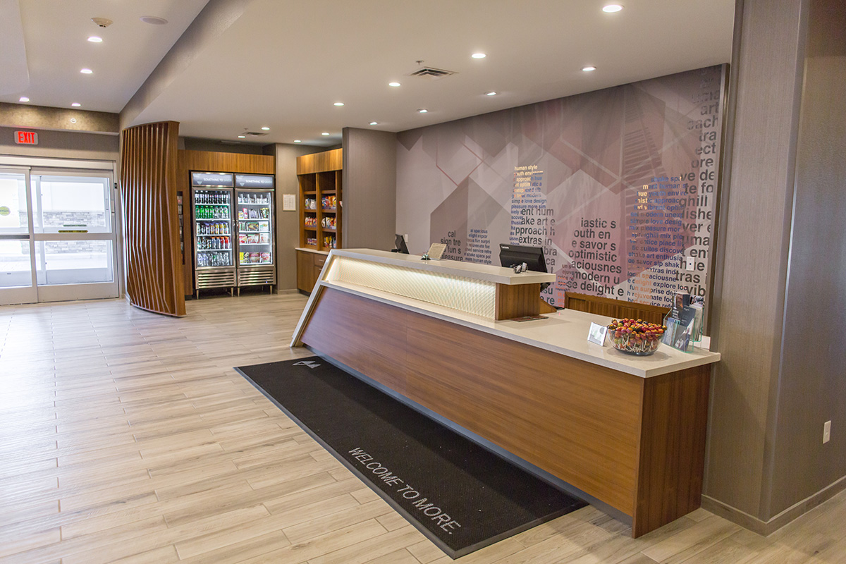 teak wood hotel reception desk and lobby store