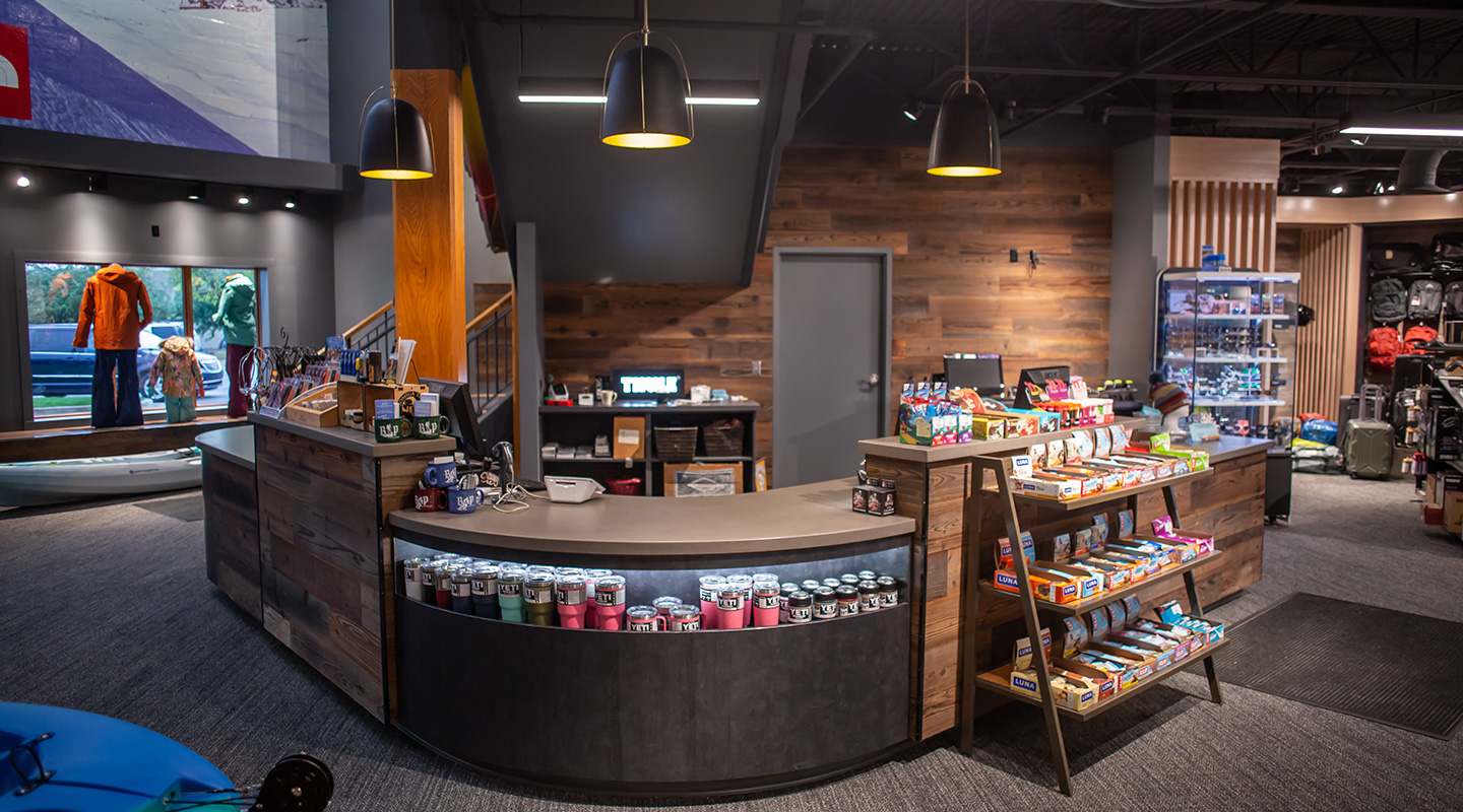 cashwrap area: concrete countertops, reclaimed redwood, metal laminate