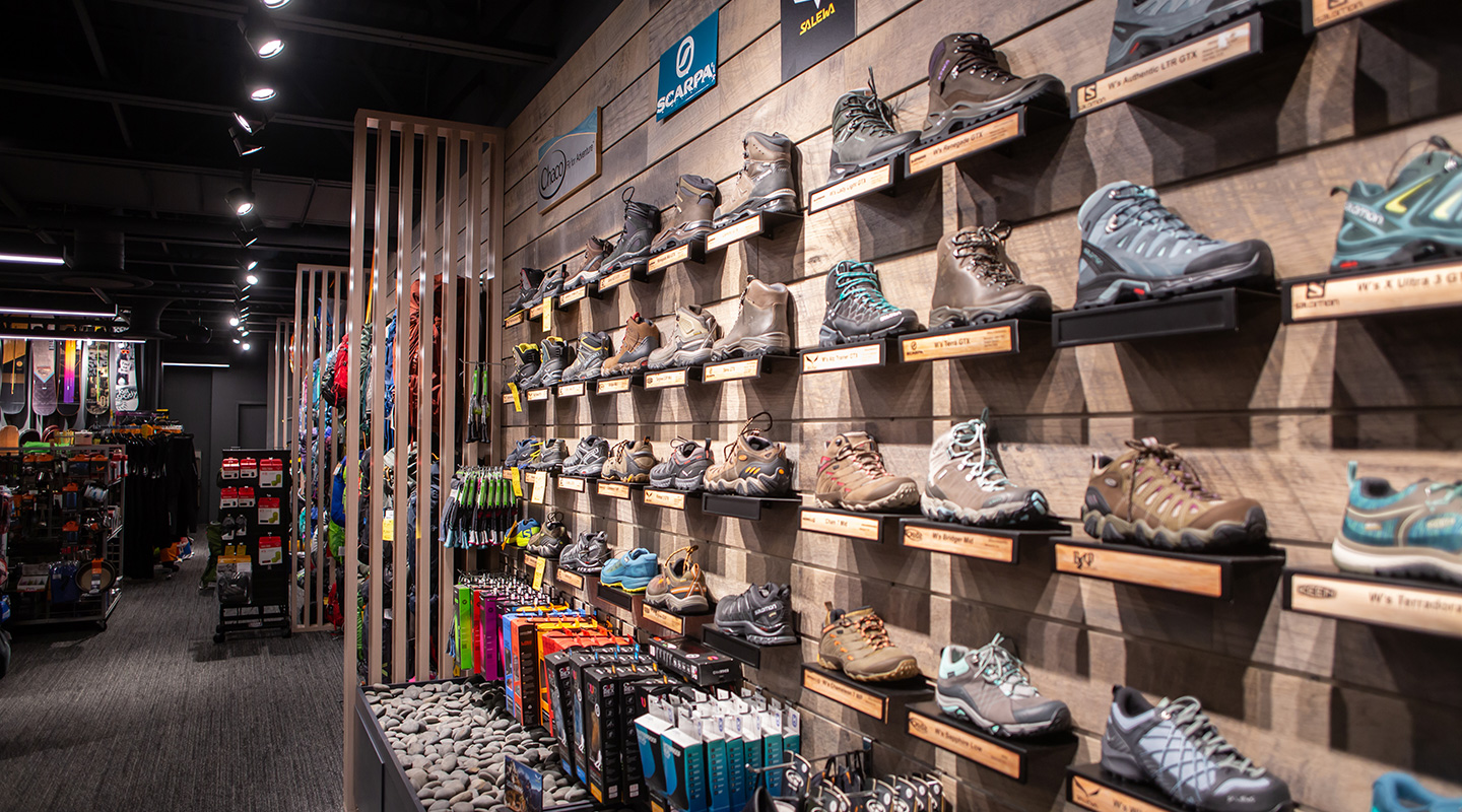 shoe retail cabinets with Mexican Beach Pebble, slatwall, wood divider walls