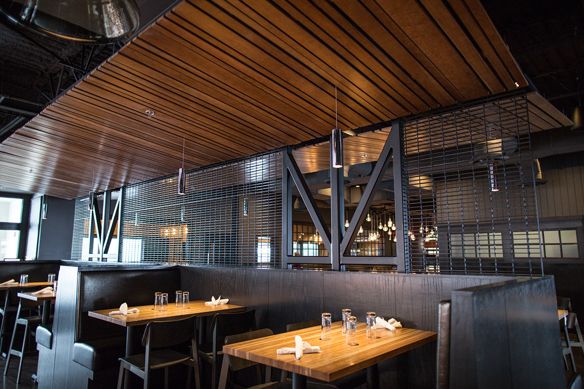 wood slat canopy over solid cherry top bar tables