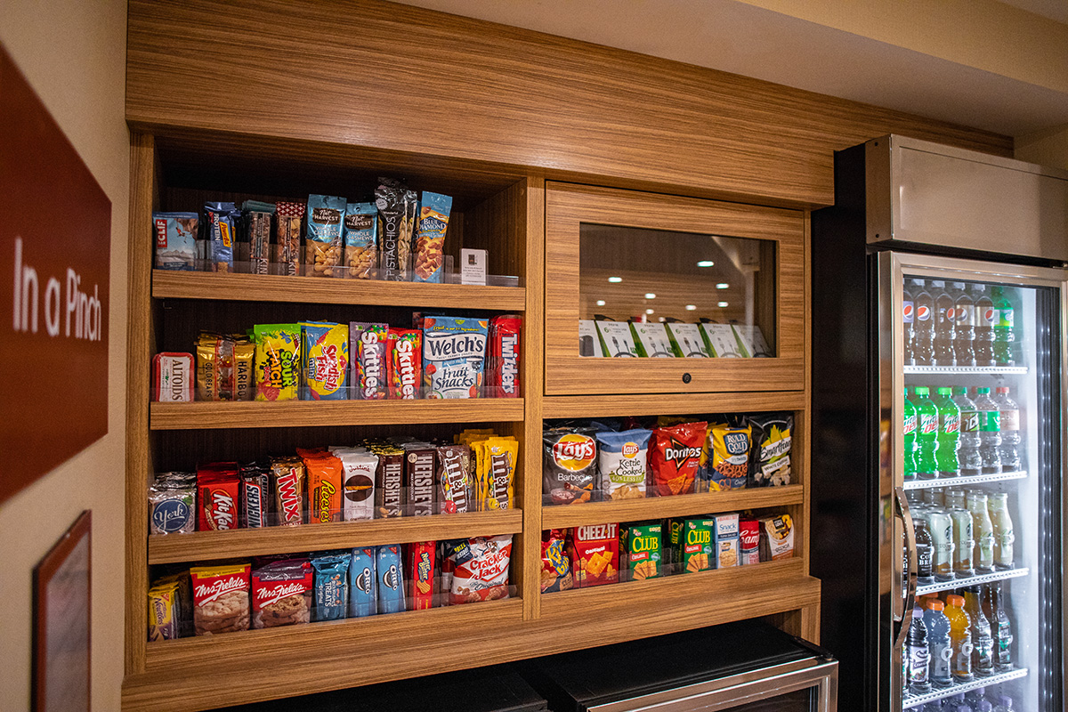 custom cabinetry for In-A-Pinch guest gift space with locking display case