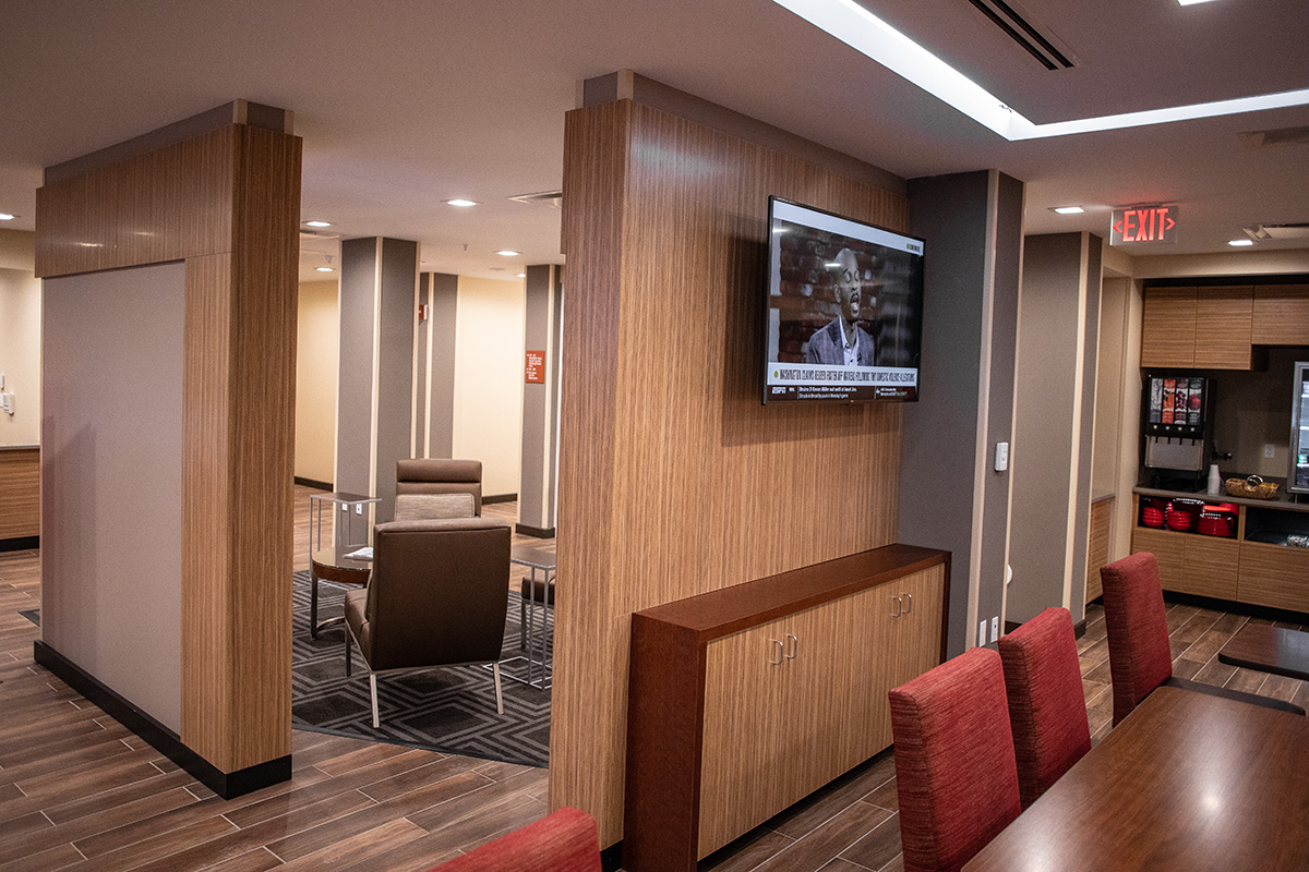 Hub Area with laminated divider wall paneling and built-in cabinets