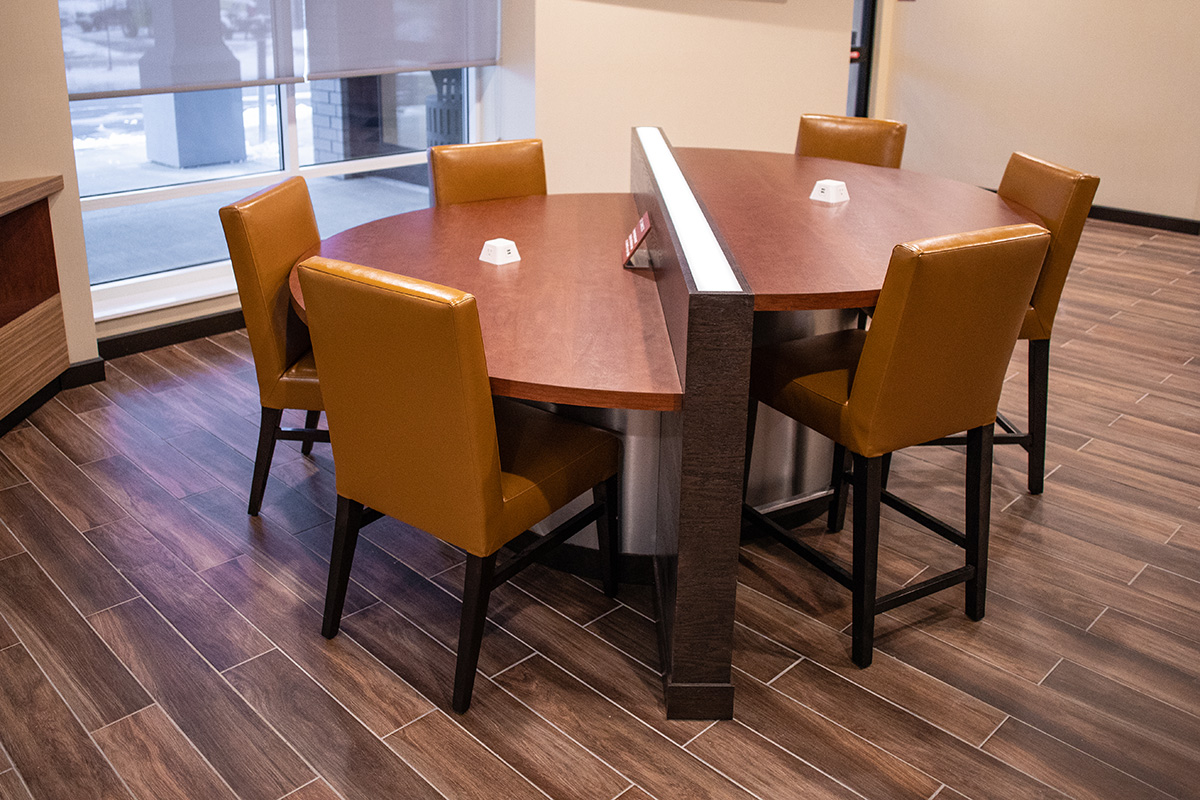 tiered communal table with dimmable light block and power supply outlets