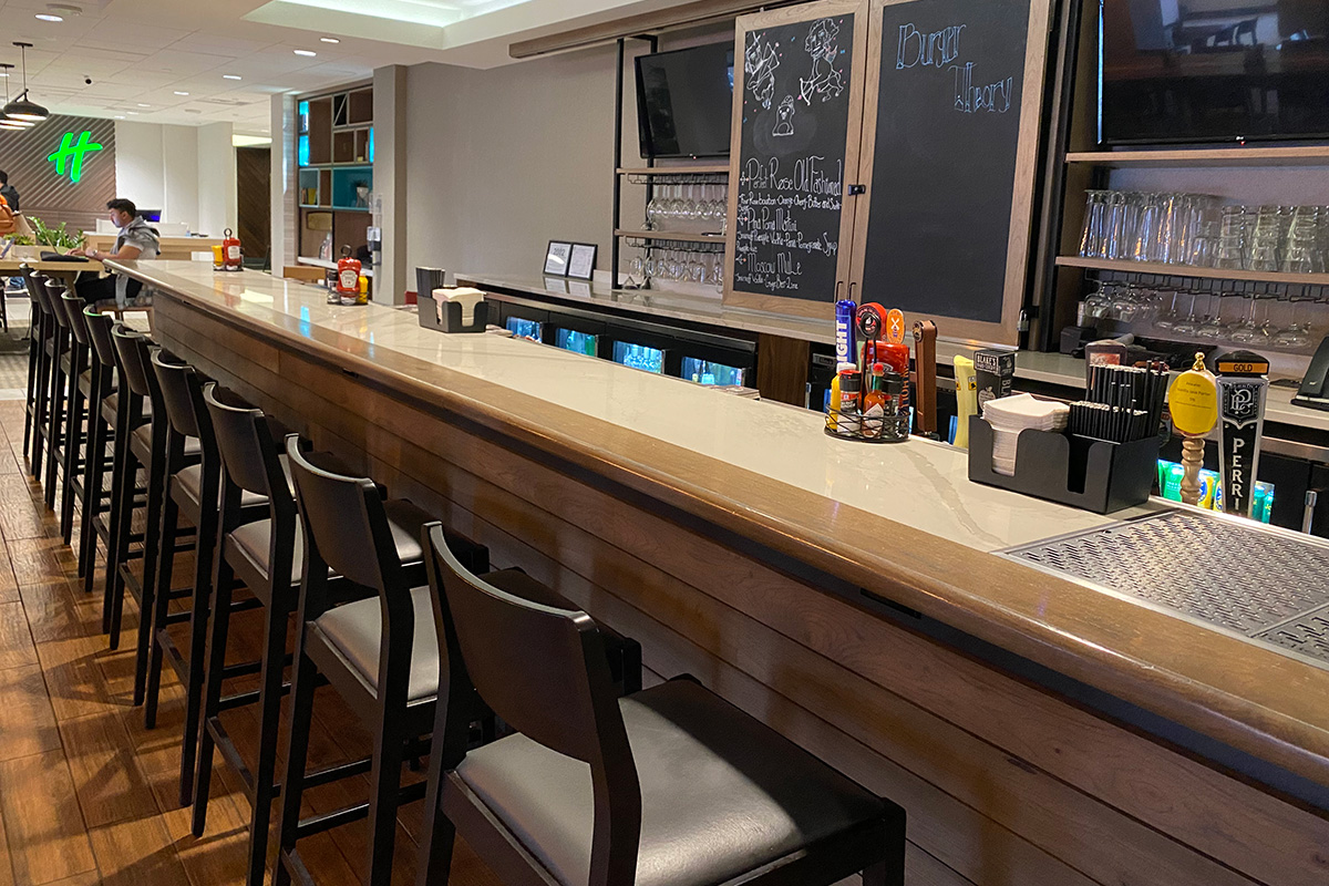 custom bar, half lap walnut planking, metal shelving, sliding chalkboard track