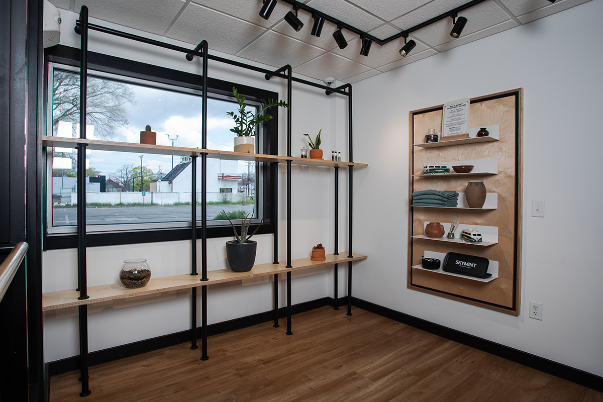 pipe shelving unit and birch framed wall display