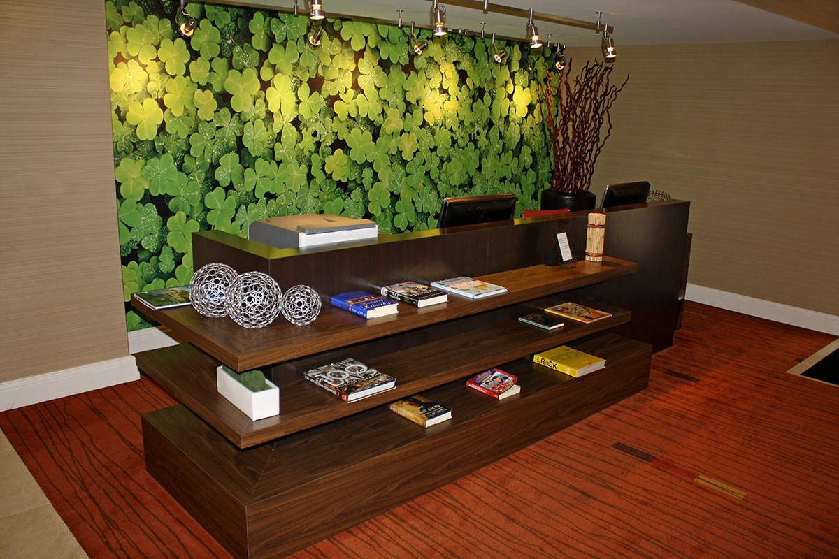 hotel reception desk with information table