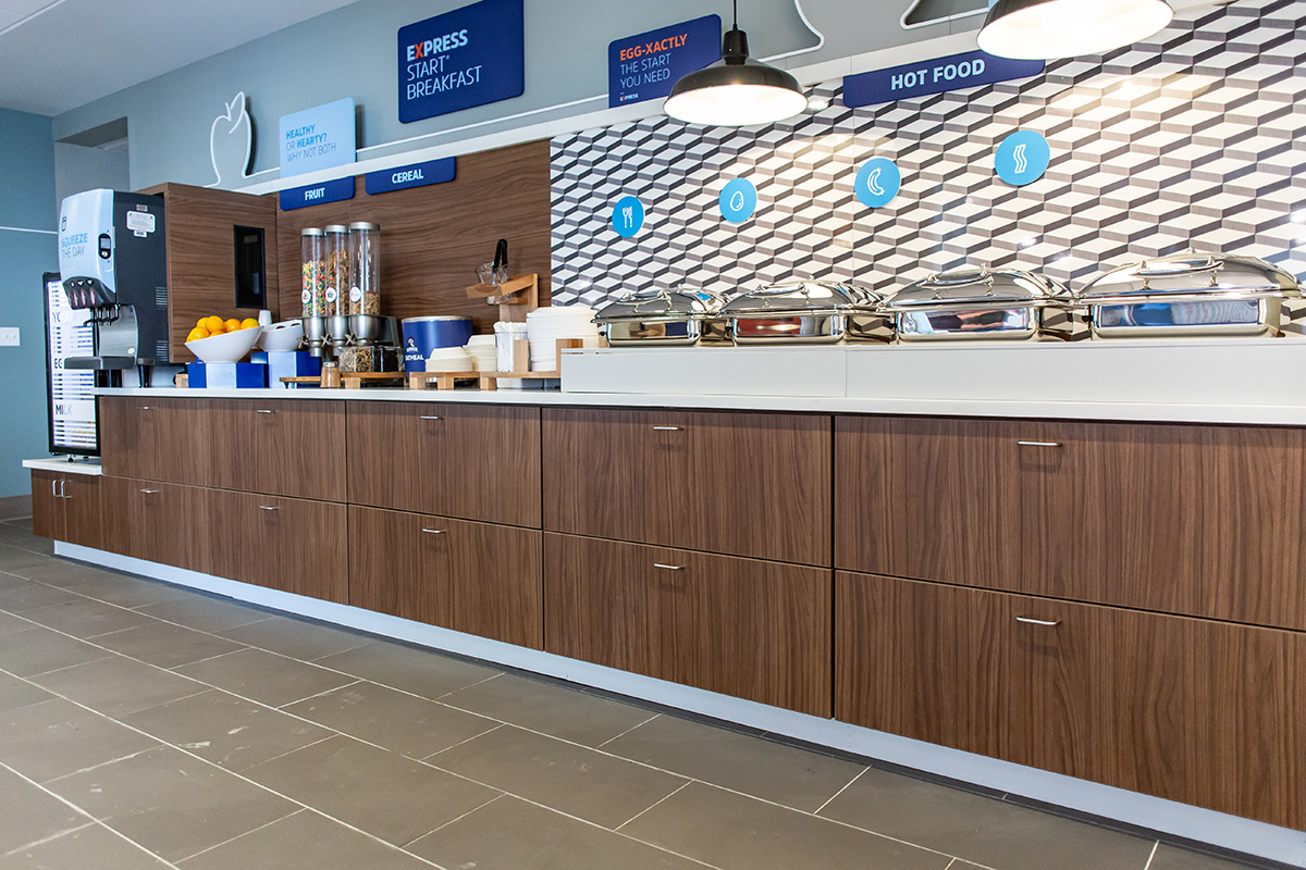 hotel cafeteria cabinetry with walnut heights laminate
