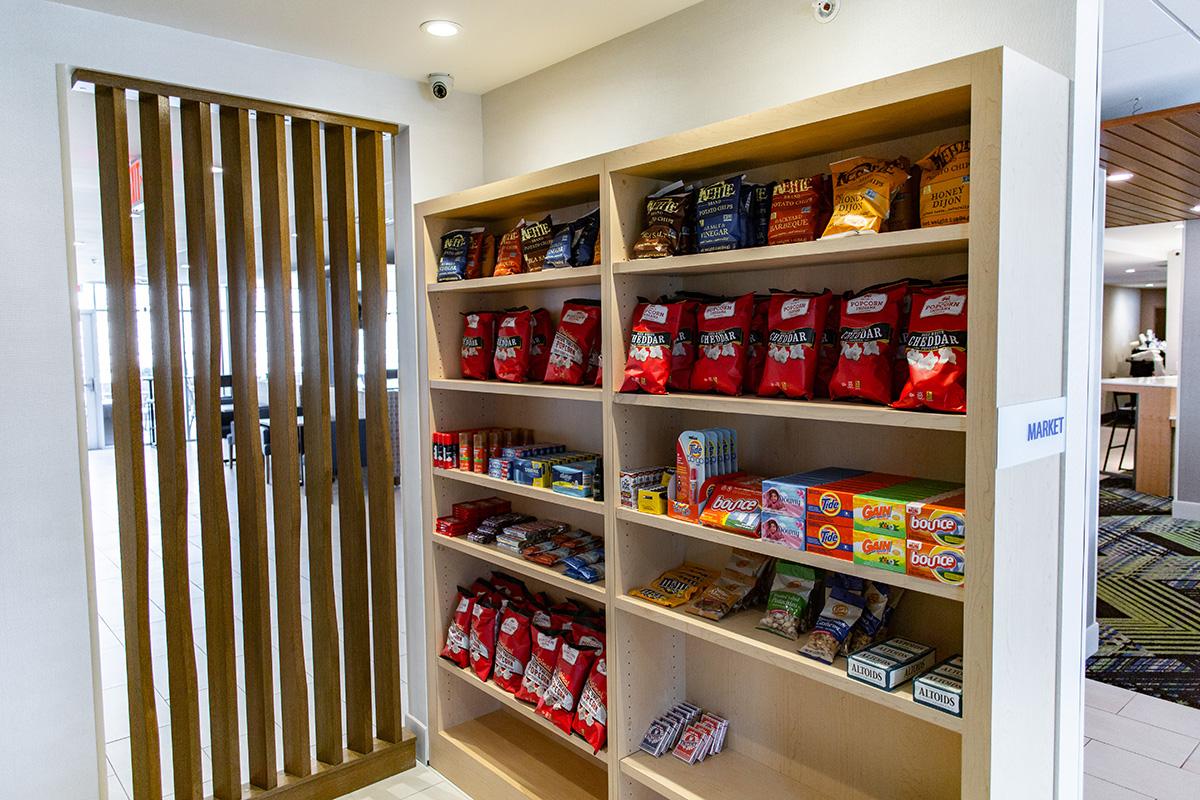 white oak market shelving and screen wall